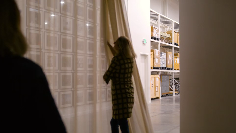 Chief Curator Llisa Demetrios giving a tour of the Eames Institute archives.
